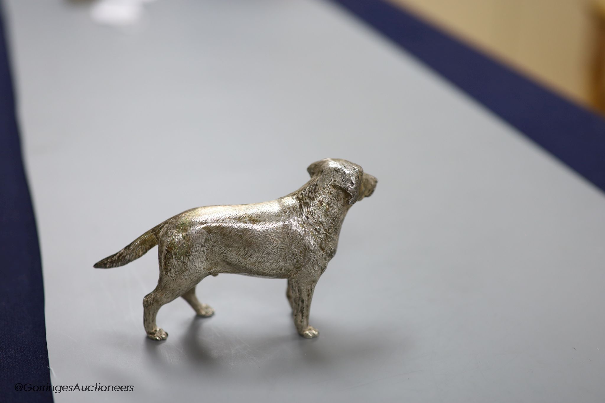 A modern free standing silver miniature model of a dog, C.F.H & Co, London, 1994, height 76mm, 243 grams.